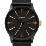 mirar educacion fisica Nixon cuero centinela negro mate/oro 86XRT48