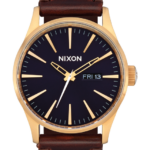 mirar educacion fisica Nixon cuero centinela oro/índigo/marrón 86XRT56